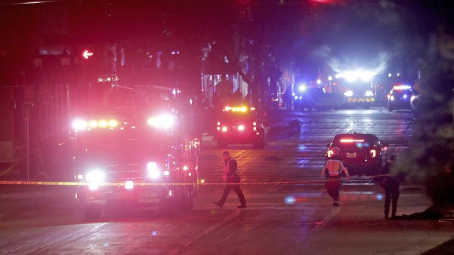 A red SUV speeds past attendees moments before plowing into a crowd at a Christmas parade in Waukesha, Wisconsin, U.S., in this still image taken from a November 21, 2021 social media video. CITY OF WAUKESHA/Facebook/via REUTERS THIS IMAGE HAS BEEN SUPPLIED BY A THIRD PARTY. MANDATORY CREDIT. NO RESALES. NO ARCHIVES.