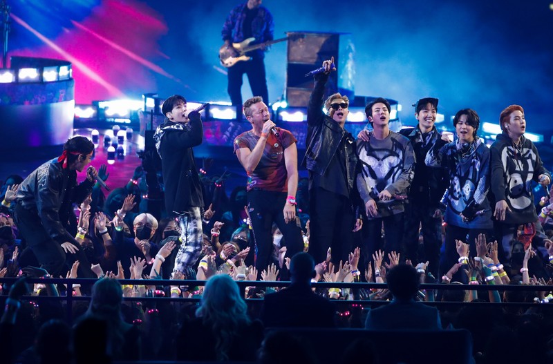 Coldplay and BTS perform during the Annual American Music Awards at the Microsoft Theatre in Los Angeles, California, U.S., November 21, 2021. REUTERS/Mario Anzuoni