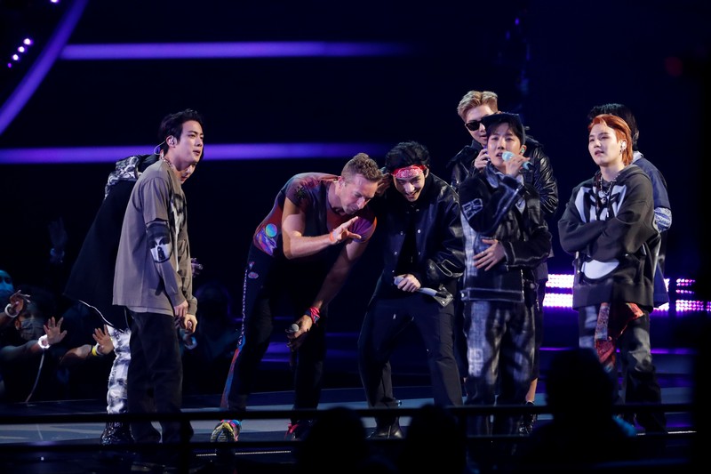 Coldplay and BTS perform during the Annual American Music Awards at the Microsoft Theatre in Los Angeles, California, U.S., November 21, 2021. REUTERS/Mario Anzuoni
