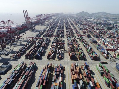 This April 23, 2017, photo released by Xinhua News Agency, shows a container dock of Yangshan Port in Shanghai, east China. U.S. President Donald Trump's latest tariff hikes on Chinese goods took effect Friday, May 10, 2019 and Beijing said it would