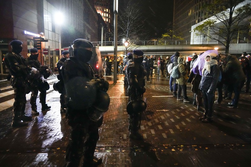 People take part in a protest following Dutch Prime Minister Mark Rutte's announcement of new measures to fight a record surge in coronavirus disease (COVID-19) infections, in The Hague, Netherlands, November 26, 2021. REUTERS/Eva Plevier