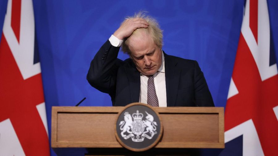 Britain's Prime Minister Boris Johnson gestures as he speaks during a press conference in London, Saturday Nov. 27, 2021, after cases of the new COVID-19 variant were confirmed in the UK. (Hollie Adams/Pool via AP)