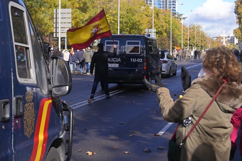 Spain Police Protest Police march past the Spanish parliament during a protest march in Madrid, Spain, Saturday, Nov. 27, 2021. Tens of thousands of Spanish police officers and their supporters rallied in Madrid on Saturday to protest against government plans to reform a controversial security law known by critics as the “gag law.” (AP Photo/Paul White)