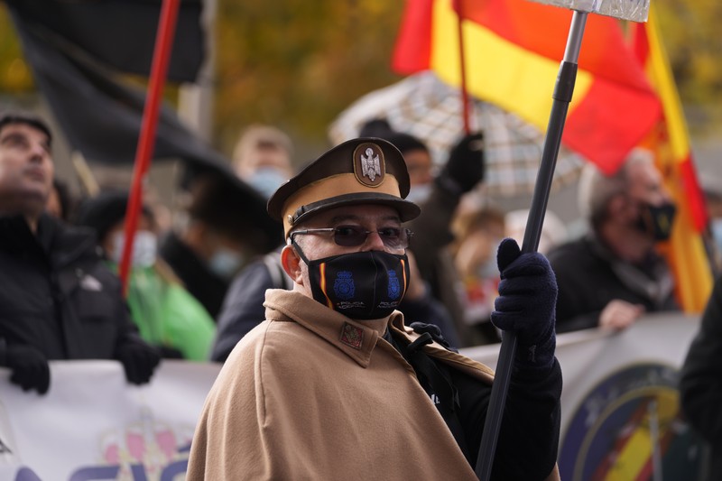 Spain Police Protest Police march past the Spanish parliament during a protest march in Madrid, Spain, Saturday, Nov. 27, 2021. Tens of thousands of Spanish police officers and their supporters rallied in Madrid on Saturday to protest against government plans to reform a controversial security law known by critics as the “gag law.” (AP Photo/Paul White)