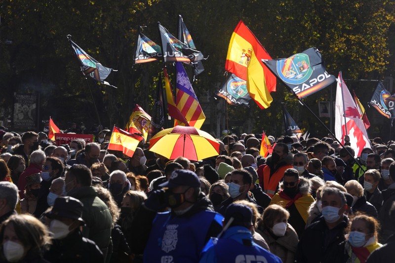 Spain Police Protest Police march past the Spanish parliament during a protest march in Madrid, Spain, Saturday, Nov. 27, 2021. Tens of thousands of Spanish police officers and their supporters rallied in Madrid on Saturday to protest against government plans to reform a controversial security law known by critics as the “gag law.” (AP Photo/Paul White)