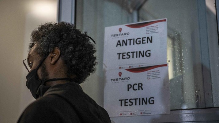 A person queues to be tested for COVID-19 in Johannesburg, South Africa, Saturday Nov. 26, 2021. As the world grapples with the emergence of the new variant of COVID-19, scientists in South Africa — where omicron was first identified — are scrambling to combat its spread across the country. (AP Photo/Jerome Delay)