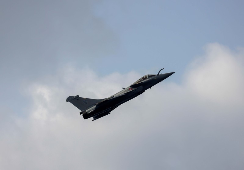A French-made Rafale fighter jet takes off on the inaugural day of the Aero India 2021 at Yelahanka air base in Bengaluru, India, Wednesday, Feb. 3, 2021. Aero India is a biennial event where aviation companies display their products and technology. (AP Photo/Aijaz Rahi)