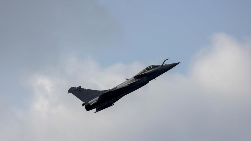 A French-made Rafale fighter jet takes off on the inaugural day of the Aero India 2021 at Yelahanka air base in Bengaluru, India, Wednesday, Feb. 3, 2021. Aero India is a biennial event where aviation companies display their products and technology. (AP Photo/Aijaz Rahi)