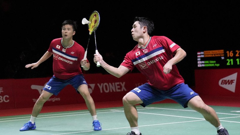 Indonesia's Marcus Fernaldi Gideon, right, and Kevin Sanjaya Sukamuljo compete against Japan's Takuro Hoki, right, and Yugo Kobayashi during their men's doubles badminton final match at the BWF World Tour Finals in Nusa Dua, Bali, Indonesia, Sunday, Dec. 5, 2021. (AP Photo/Dita Alangkara)