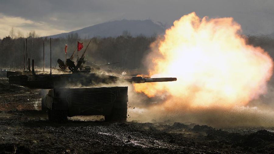 Japanese Ground-Self Defense Force (JGDDF) Type 90 tank fires its gun at a target during a live-fire annual exercise at the Minami Eniwa Camp Monday, Dec. 6, 2021, in Eniwa, on the northern Japan island of Hokkaido. Dozens of tanks are rolling over the next two weeks on Hokkaido, a main military stronghold for a country with perhaps the world's most little known yet powerful army. (AP Photo/Eugene Hoshiko)