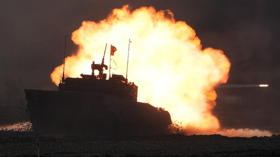 Japanese Ground-Self Defense Force (JGDDF) Type 90 tanks drive toward a target during the annual drill with live ammunitions exercise at Minami Eniwa Camp Monday, Dec. 6, 2021, in Eniwa, northern Japan of Hokkaido. Dozens of tanks are rolling over the next two weeks on Hokkaido, a main military stronghold for a country with perhaps the world's most little known yet powerful army. (AP Photo/Eugene Hoshiko)
