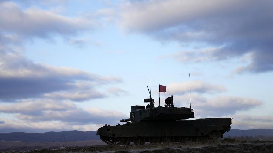 Japanese Ground-Self Defense Force (JGDDF) Type 90 tanks drive toward a target during the annual drill with live ammunitions exercise at Minami Eniwa Camp Monday, Dec. 6, 2021, in Eniwa, northern Japan of Hokkaido. Dozens of tanks are rolling over the next two weeks on Hokkaido, a main military stronghold for a country with perhaps the world's most little known yet powerful army. (AP Photo/Eugene Hoshiko)