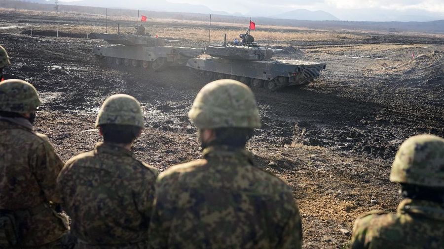 Japanese Ground-Self Defense Force (JGDDF) Type 90 tanks drive toward a target during the annual drill with live ammunitions exercise at Minami Eniwa Camp Monday, Dec. 6, 2021, in Eniwa, northern Japan of Hokkaido. Dozens of tanks are rolling over the next two weeks on Hokkaido, a main military stronghold for a country with perhaps the world's most little known yet powerful army. (AP Photo/Eugene Hoshiko)