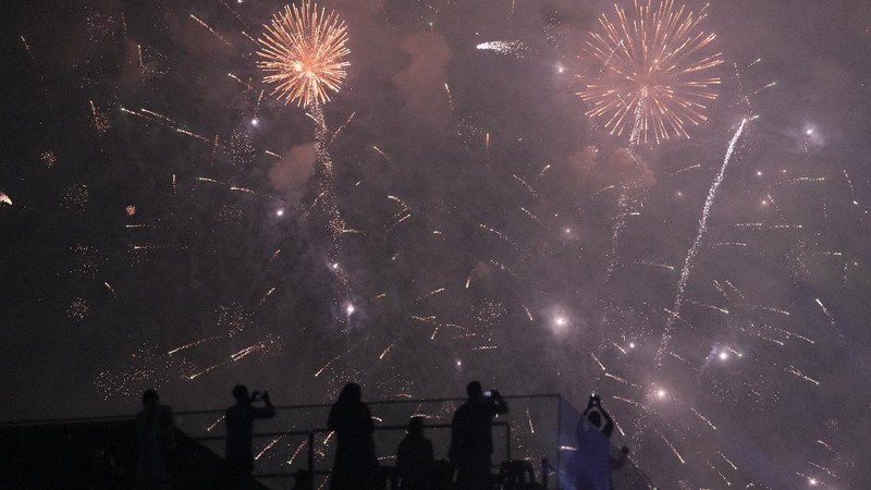 People watch fireworks at the end of the Formula One Saudi Arabian Grand Prix in Jiddah, Sunday, Dec. 5, 2021. AP Photo/Hassan Ammar)