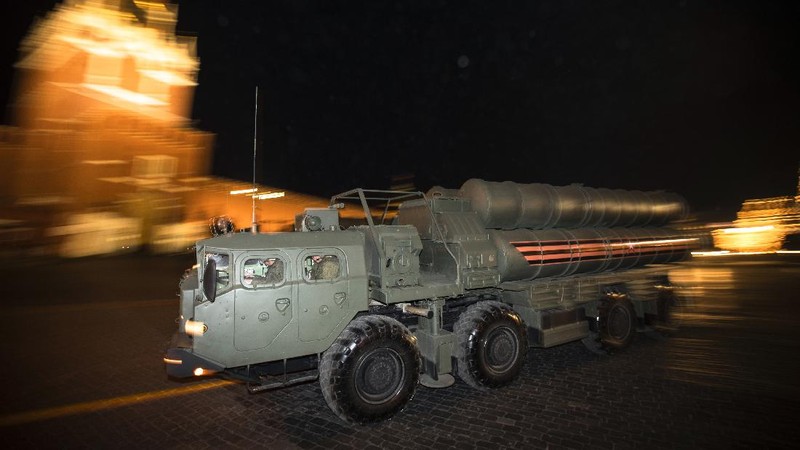 FILE - In this Tuesday, Aug. 27, 2019 file photo, a truck carrying parts of the S-400 air defense systems, exits a Russian transport aircraft after landing at Murted military airport outside Ankara, Turkey.  The Trump administration is imposing sanctions on its NATO ally Turkey over its purchase of a Russian air defense system. The move comes at a delicate time in relations between Washington and Ankara. The countries have been at odds over Turkey's acquisition from Russia of the S-400 missile defense system.  (Turkish Defence Ministry via AP, Pool, File)