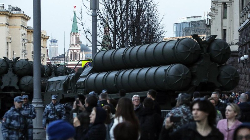 FILE - In this Tuesday, Aug. 27, 2019 file photo, a truck carrying parts of the S-400 air defense systems, exits a Russian transport aircraft after landing at Murted military airport outside Ankara, Turkey.  The Trump administration is imposing sanctions on its NATO ally Turkey over its purchase of a Russian air defense system. The move comes at a delicate time in relations between Washington and Ankara. The countries have been at odds over Turkey's acquisition from Russia of the S-400 missile defense system.  (Turkish Defence Ministry via AP, Pool, File)