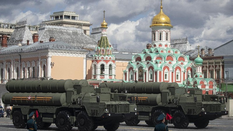 FILE - In this Tuesday, Aug. 27, 2019 file photo, a truck carrying parts of the S-400 air defense systems, exits a Russian transport aircraft after landing at Murted military airport outside Ankara, Turkey.  The Trump administration is imposing sanctions on its NATO ally Turkey over its purchase of a Russian air defense system. The move comes at a delicate time in relations between Washington and Ankara. The countries have been at odds over Turkey's acquisition from Russia of the S-400 missile defense system.  (Turkish Defence Ministry via AP, Pool, File)