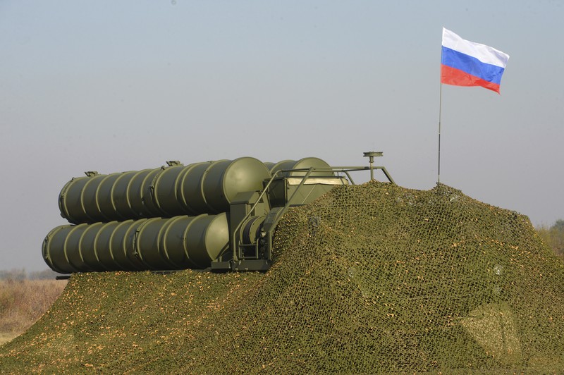 FILE - In this Tuesday, Aug. 27, 2019 file photo, a truck carrying parts of the S-400 air defense systems, exits a Russian transport aircraft after landing at Murted military airport outside Ankara, Turkey.  The Trump administration is imposing sanctions on its NATO ally Turkey over its purchase of a Russian air defense system. The move comes at a delicate time in relations between Washington and Ankara. The countries have been at odds over Turkey's acquisition from Russia of the S-400 missile defense system.  (Turkish Defence Ministry via AP, Pool, File)