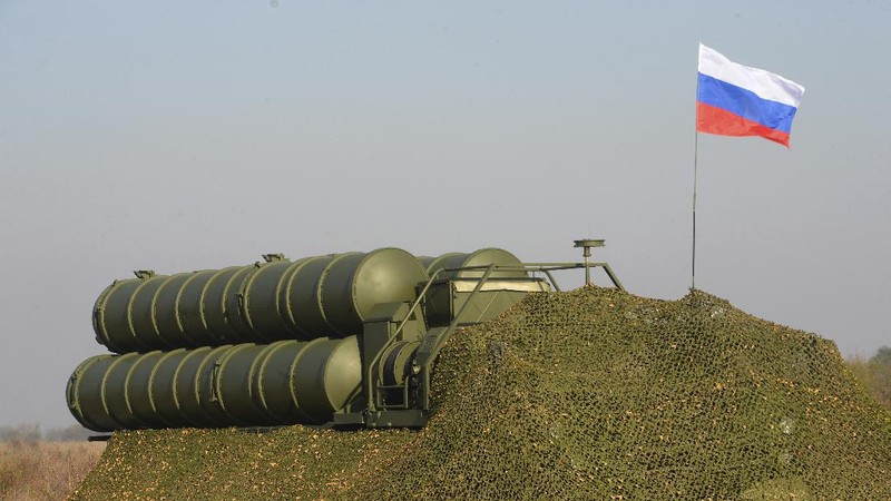 FILE - In this Tuesday, Aug. 27, 2019 file photo, a truck carrying parts of the S-400 air defense systems, exits a Russian transport aircraft after landing at Murted military airport outside Ankara, Turkey.  The Trump administration is imposing sanctions on its NATO ally Turkey over its purchase of a Russian air defense system. The move comes at a delicate time in relations between Washington and Ankara. The countries have been at odds over Turkey's acquisition from Russia of the S-400 missile defense system.  (Turkish Defence Ministry via AP, Pool, File)