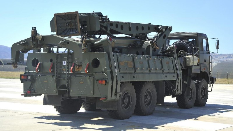FILE - In this Tuesday, Aug. 27, 2019 file photo, a truck carrying parts of the S-400 air defense systems, exits a Russian transport aircraft after landing at Murted military airport outside Ankara, Turkey.  The Trump administration is imposing sanctions on its NATO ally Turkey over its purchase of a Russian air defense system. The move comes at a delicate time in relations between Washington and Ankara. The countries have been at odds over Turkey's acquisition from Russia of the S-400 missile defense system.  (Turkish Defence Ministry via AP, Pool, File)