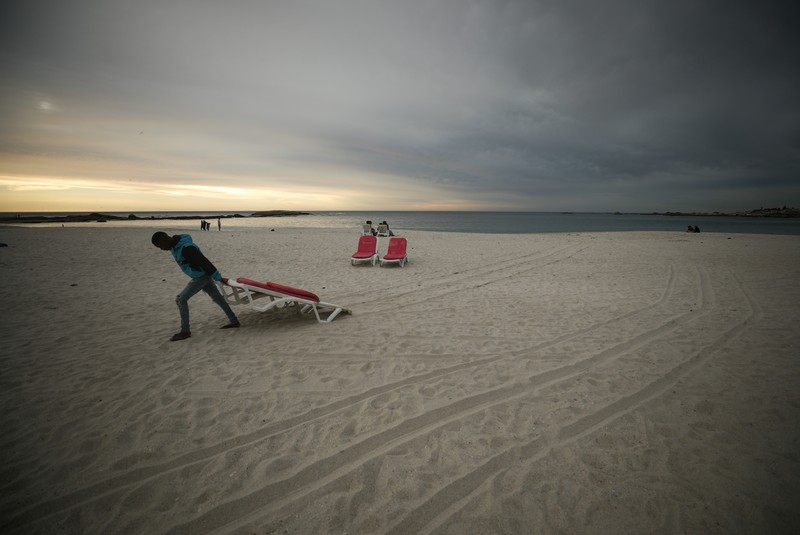 Empty recliners are seen at the popular Camps Bay Beach as numbers of international tourists decline following recent coronavirus disease (COVID-19) travel restrictions, in Cape Town, South Africa, December 3, 2021. Picture taken December 3, 2021. REUTERS/Mike Hutchings