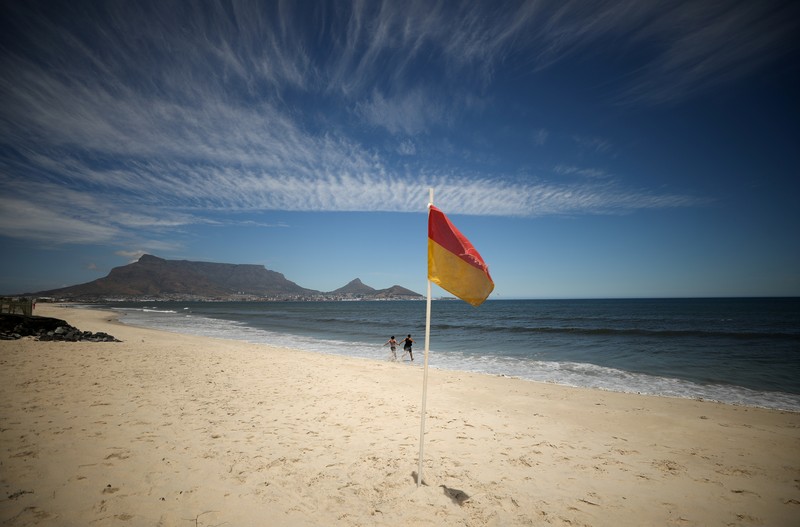 Empty recliners are seen at the popular Camps Bay Beach as numbers of international tourists decline following recent coronavirus disease (COVID-19) travel restrictions, in Cape Town, South Africa, December 3, 2021. Picture taken December 3, 2021. REUTERS/Mike Hutchings