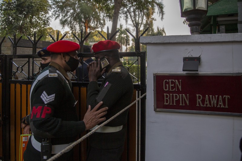 Smoke rises from fire after an army helicopter carrying India's Chief of Defense Staff Bipin Rawat crashed near Coonoor, Tamil Nadu state,  India, Wednesday, Dec. 8, 2021. India’s military chief, Gen. Bipin Rawat, and 12 others were killed Wednesday in a helicopter crash in southern Tamil Nadu state, the air force said. (Bangalore New Photos via AP)