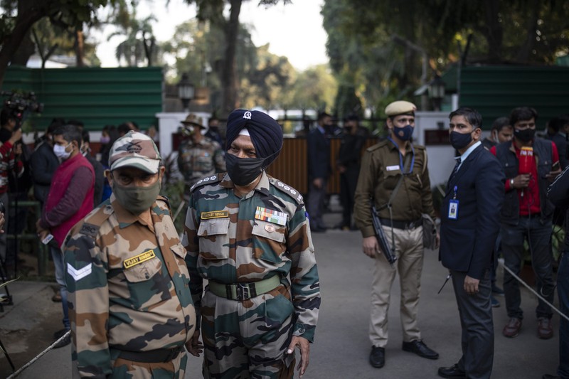 Smoke rises from fire after an army helicopter carrying India's Chief of Defense Staff Bipin Rawat crashed near Coonoor, Tamil Nadu state,  India, Wednesday, Dec. 8, 2021. India’s military chief, Gen. Bipin Rawat, and 12 others were killed Wednesday in a helicopter crash in southern Tamil Nadu state, the air force said. (Bangalore New Photos via AP)