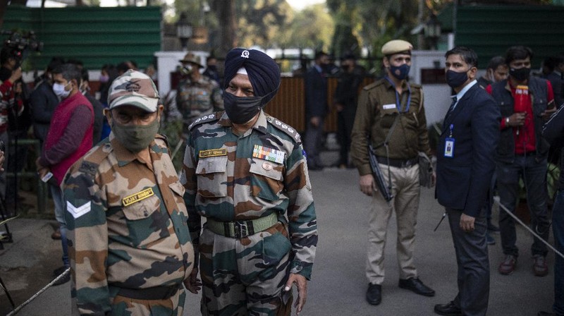 Smoke rises from fire after an army helicopter carrying India's Chief of Defense Staff Bipin Rawat crashed near Coonoor, Tamil Nadu state,  India, Wednesday, Dec. 8, 2021. India’s military chief, Gen. Bipin Rawat, and 12 others were killed Wednesday in a helicopter crash in southern Tamil Nadu state, the air force said. (Bangalore New Photos via AP)