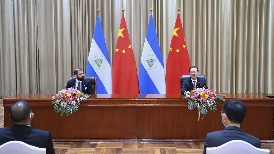 In this photo released by China’s Xinhua News Agency, representatives Laureano Ortega Murillo, son of and advisor to Nicaraguan President Daniel Ortega, left, and Chinese Vice Foreign Minister Ma Zhaoxu sign a joint communique on the resumption of diplomatic relations between the two countries in northern China’s Tianjin Municipality, Friday, Dec. 10, 2021. Taiwan lost Nicaragua as a diplomatic ally after the Central American country said it would officially recognize only China, which claims self-ruled Taiwan as part of its territory. (Yue Yuewei/Xinhua via AP)