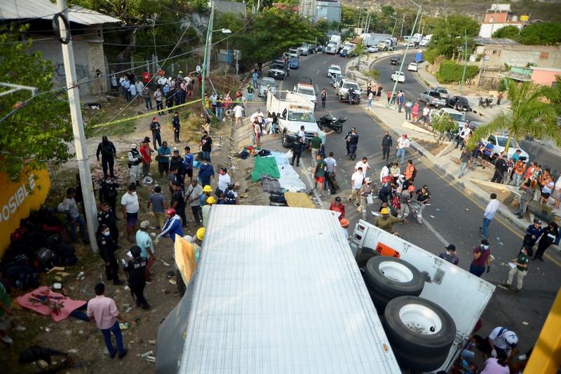 An overturned truck is seen after a trailer crash in the southern Mexican state of Chiapas killed at least 49 people, most of them migrants from Central America, officials said on Thursday, in Tuxtla Gutierrez, Chiapas, Mexico December 9, 2021, in this picture obtained from social media. Mandatory credit El La Mira/via REUTERS ATTENTION EDITORS - THIS IMAGE HAS BEEN SUPPLIED BY A THIRD PARTY. MANDATORY CREDIT. NO RESALES. NO ARCHIVES.