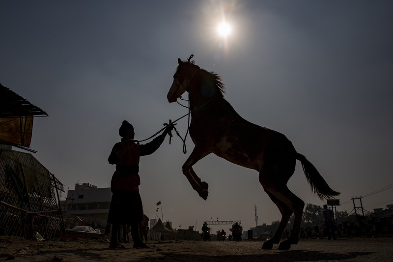 Farmers vacate a protest site, after the government agreed to their demands, including assurances to consider guaranteed prices for all produce, at the Singhu border near New Delhi, India, December 11, 2021. REUTERS/Adnan Abidi