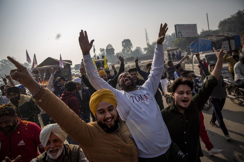 Farmers vacate a protest site, after the government agreed to their demands, including assurances to consider guaranteed prices for all produce, at the Singhu border near New Delhi, India, December 11, 2021. REUTERS/Adnan Abidi