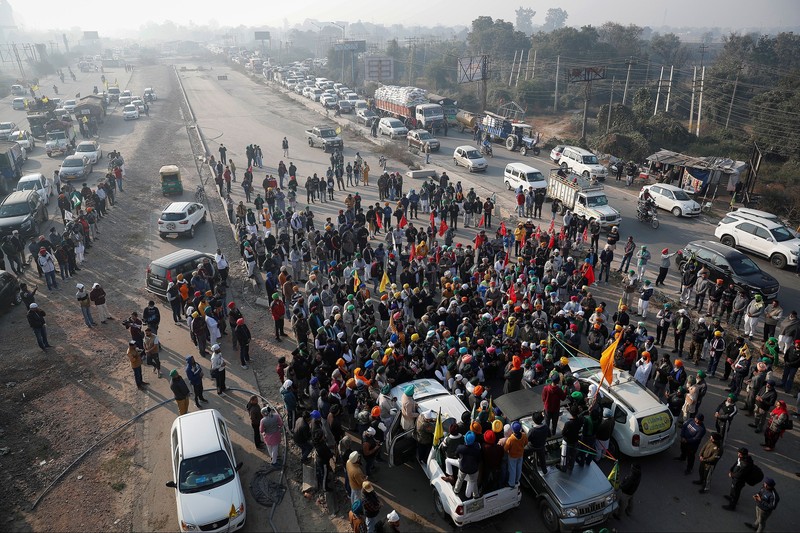 Farmers vacate a protest site, after the government agreed to their demands, including assurances to consider guaranteed prices for all produce, at the Singhu border near New Delhi, India, December 11, 2021. REUTERS/Adnan Abidi