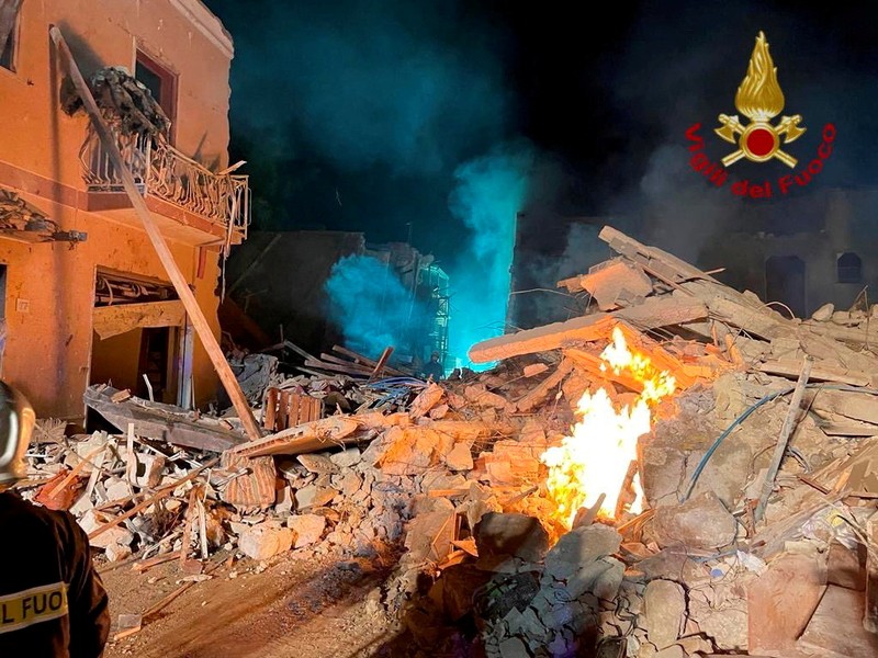 Debris is seen as members of the fire brigade work to rescue survivors after a four-storey building collapsed in the Sicilian town of Ravanusa following a gas explosion, in Italy, in this undated image obtained via social media on December 12, 2021.  Vigili del Fuoco via REUTERS ATTENTION EDITORS - THIS IMAGE HAS BEEN SUPPLIED BY A THIRD PARTY. WATERMARK FROM SOURCE. DO NOT OBSCURE LOGO.