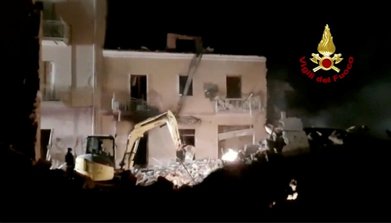 Debris is seen as members of the fire brigade work to rescue survivors after a four-storey building collapsed in the Sicilian town of Ravanusa following a gas explosion, in Italy, in this undated image obtained via social media on December 12, 2021.  Vigili del Fuoco via REUTERS ATTENTION EDITORS - THIS IMAGE HAS BEEN SUPPLIED BY A THIRD PARTY. WATERMARK FROM SOURCE. DO NOT OBSCURE LOGO.
