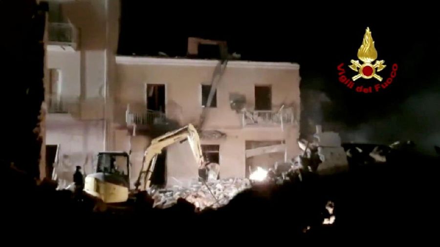 Debris is seen as members of the fire brigade work to rescue survivors after a four-storey building collapsed in the Sicilian town of Ravanusa following a gas explosion, in Italy, in this undated image obtained via social media on December 12, 2021.  Vigili del Fuoco via REUTERS ATTENTION EDITORS - THIS IMAGE HAS BEEN SUPPLIED BY A THIRD PARTY. WATERMARK FROM SOURCE. DO NOT OBSCURE LOGO.