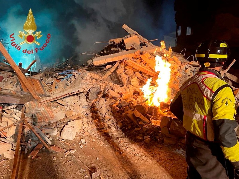 Debris is seen as members of the fire brigade work to rescue survivors after a four-storey building collapsed in the Sicilian town of Ravanusa following a gas explosion, in Italy, in this undated image obtained via social media on December 12, 2021.  Vigili del Fuoco via REUTERS ATTENTION EDITORS - THIS IMAGE HAS BEEN SUPPLIED BY A THIRD PARTY. WATERMARK FROM SOURCE. DO NOT OBSCURE LOGO.