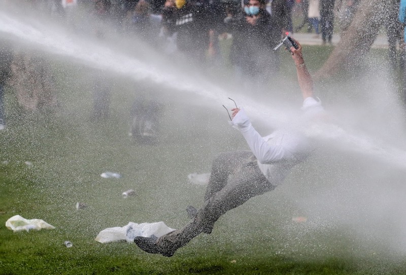 An explosion caused by a police munition is seen while supporters of U.S. President Donald Trump riot in front of the U.S. Capitol Building in Washington, U.S., January 6, 2021.  Reuters photographer Leah Millis: 