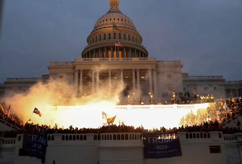 An explosion caused by a police munition is seen while supporters of U.S. President Donald Trump riot in front of the U.S. Capitol Building in Washington, U.S., January 6, 2021.  Reuters photographer Leah Millis: 