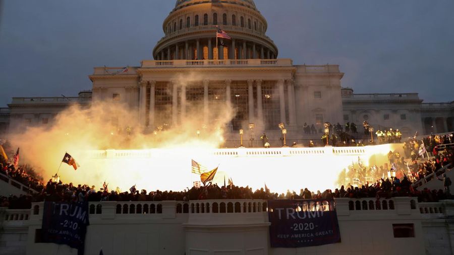 An explosion caused by a police munition is seen while supporters of U.S. President Donald Trump riot in front of the U.S. Capitol Building in Washington, U.S., January 6, 2021.  Reuters photographer Leah Millis: 