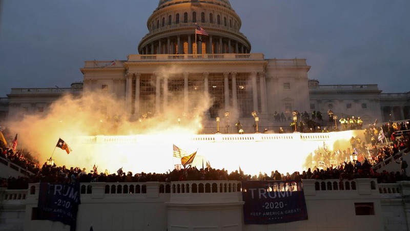 An explosion caused by a police munition is seen while supporters of U.S. President Donald Trump riot in front of the U.S. Capitol Building in Washington, U.S., January 6, 2021.  Reuters photographer Leah Millis: 