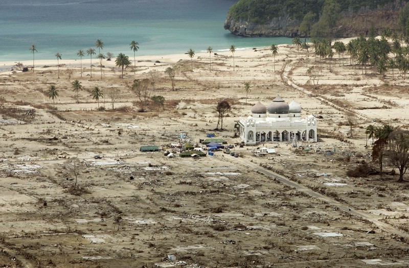 Tsunami A Look Back Photo Gallery FILE - In this Jan. 30, 2005 file photo, an aerial view shows the Rahmatullah Lampuuk mosque in the village of Lhoknga, near Banda Aceh, Indonesia. Friday marks the 10th anniversary of one of the deadliest natural disasters in world history: a tsunami, triggered by a massive earthquake off the Indonesian coast, leaving more than 230,000 people dead in 14 countries and causing about $10 billion in damage. Countries from Indonesia to India to Africa's east coast were hit, leaving shocking scenes of death and destruction. (AP Photo/Greg Baker, File)