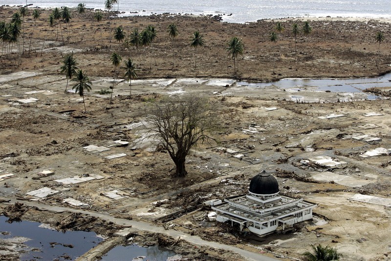 Tsunami A Look Back Photo Gallery FILE - In this Jan. 30, 2005 file photo, an aerial view shows the Rahmatullah Lampuuk mosque in the village of Lhoknga, near Banda Aceh, Indonesia. Friday marks the 10th anniversary of one of the deadliest natural disasters in world history: a tsunami, triggered by a massive earthquake off the Indonesian coast, leaving more than 230,000 people dead in 14 countries and causing about $10 billion in damage. Countries from Indonesia to India to Africa's east coast were hit, leaving shocking scenes of death and destruction. (AP Photo/Greg Baker, File)