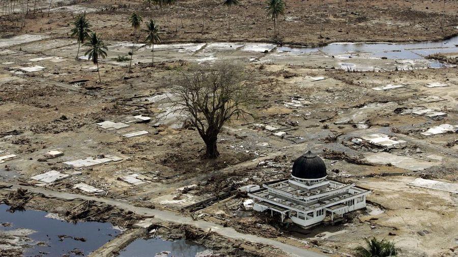 FILE - In this Sunday, Jan. 2, 2005 file photo, a mosque remains in a village wiped out by tsunamis in Keude Teunom, Aceh province in northwestern Indonesia. Some 230,000 people were killed in the Indian Ocean tsunami set off by a magnitude 9.1 earthquake on Dec. 26, 2004. A dozen countries were hit, from Indonesia to India to Africa's east coast. Scores of Associated Press journalists covered the disaster, and as the 10th anniversary approached, the AP asked 10 of them to describe the images that have stuck with them the most. This is the ninth of their stories, which are being published daily through Dec. 26. (AP Photo/Eugene Hoshiko, File)