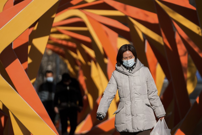 A rider travels on an empty road following lockdown measures to curb the spread of the coronavirus disease (COVID-19) in Xian, Shaanxi province, China December 26, 2021. Picture taken December 26, 2021. cnsphoto via REUTERS   ATTENTION EDITORS - THIS IMAGE WAS PROVIDED BY A THIRD PARTY. CHINA OUT.