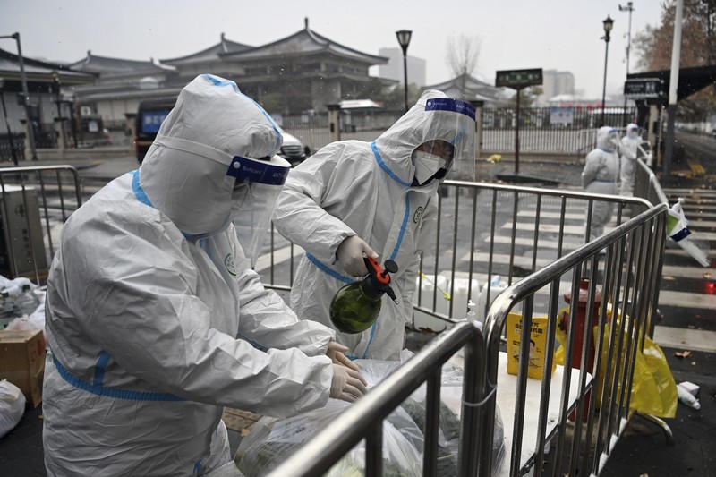 A rider travels on an empty road following lockdown measures to curb the spread of the coronavirus disease (COVID-19) in Xian, Shaanxi province, China December 26, 2021. Picture taken December 26, 2021. cnsphoto via REUTERS   ATTENTION EDITORS - THIS IMAGE WAS PROVIDED BY A THIRD PARTY. CHINA OUT.