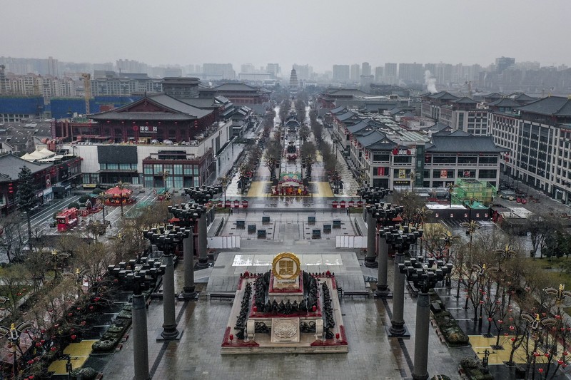 A rider travels on an empty road following lockdown measures to curb the spread of the coronavirus disease (COVID-19) in Xian, Shaanxi province, China December 26, 2021. Picture taken December 26, 2021. cnsphoto via REUTERS   ATTENTION EDITORS - THIS IMAGE WAS PROVIDED BY A THIRD PARTY. CHINA OUT.