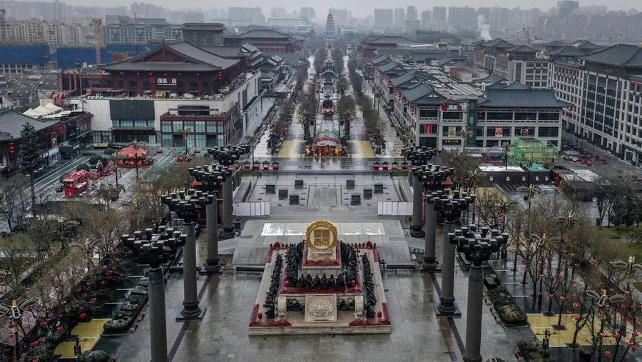 A rider travels on an empty road following lockdown measures to curb the spread of the coronavirus disease (COVID-19) in Xian, Shaanxi province, China December 26, 2021. Picture taken December 26, 2021. cnsphoto via REUTERS   ATTENTION EDITORS - THIS IMAGE WAS PROVIDED BY A THIRD PARTY. CHINA OUT.