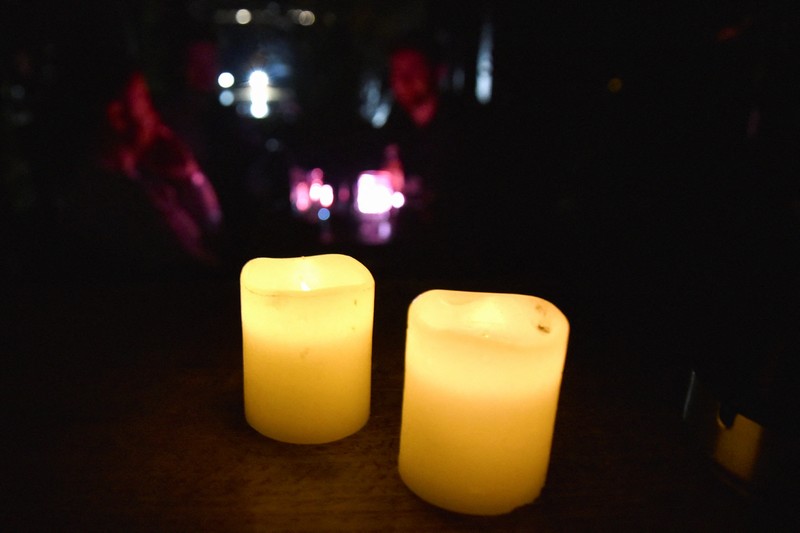 KOSOVO-POWER/OUTAGES Candles are pictured at a bar during the power cut in Pristina, Kosovo, December 27, 2021. Picture taken December 27, 2021. REUTERS/Laura Hasani